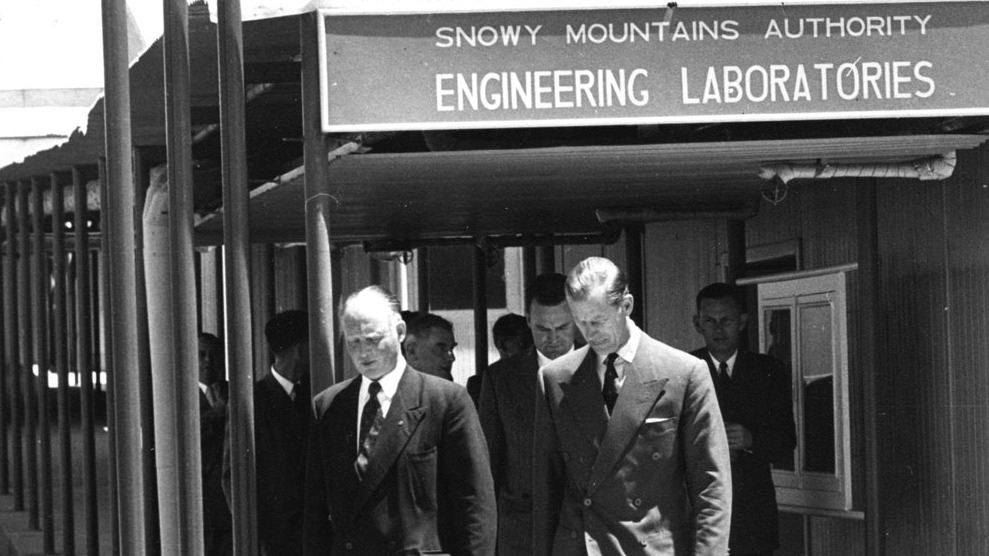 Image 1 of 5 - A photograph of Thomas Leech walking with His Royal Highness the Duke of Edinburgh. This photograph was taken when the Duke of Edinburgh visited the Snowy Mountains Authority Engineering Laboratories.