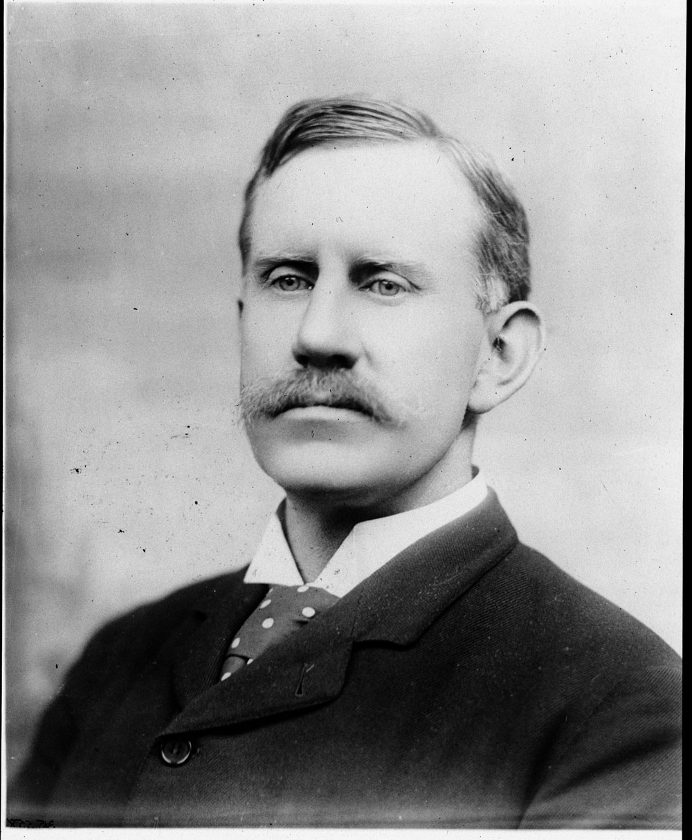 A formal portrait of Walter Liberty Vernon taken by the Government Printing Office. He wears a dark suit and polka-dot tie. 