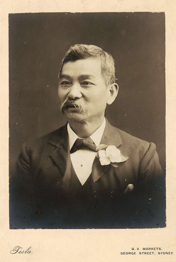 Image 1 of 6 - Portrait of Quong Tart in a tuxedo glancing to the left, with flower in his left lapel and a bow tie. Text at the bottom left reads ‘Tesla’ and the bottom right reads ‘Q.V. MARKETS, GEORGE STREET, SYDNEY.’