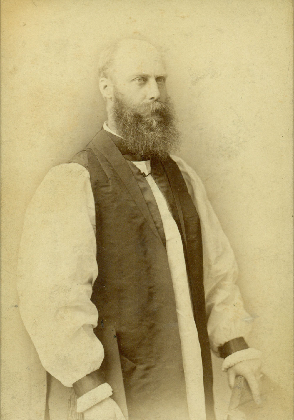 Image 2 of 6 - A formal portrait of Bishop Sydney Linton. He stands, looking to the right of frame wearing vestments