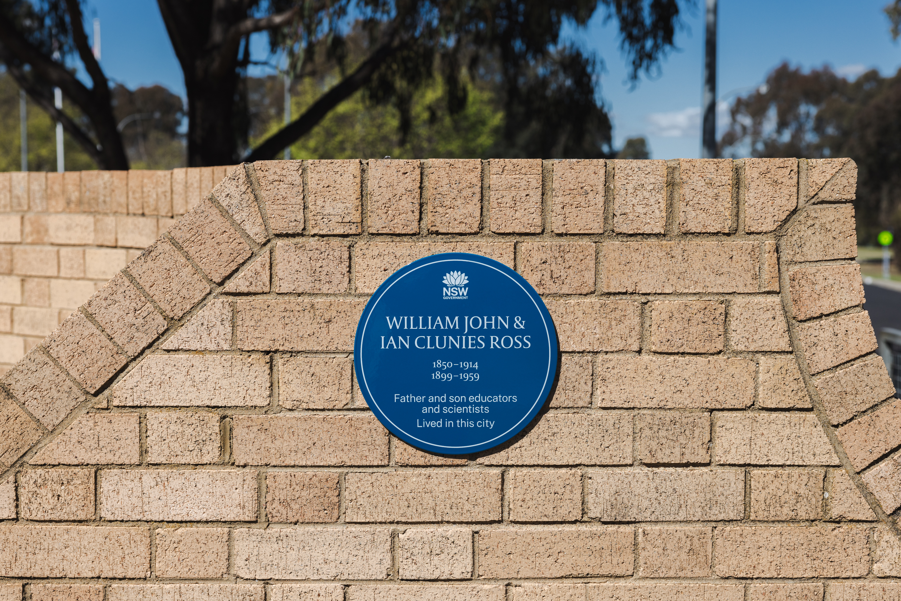 Image 4 of 4 - A photo of a blue plaque on a brick wall
