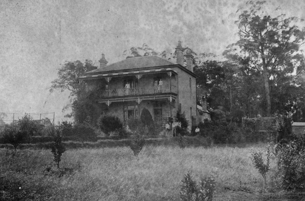 Image 1 of 5 - Black and white picture of two storey house with colonial balcony.