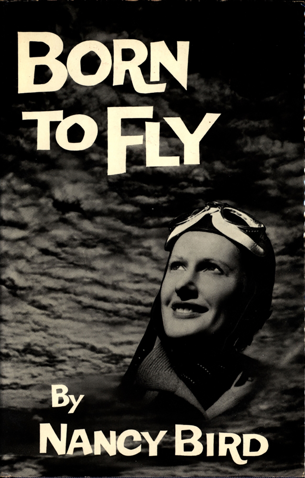 Image 4 of 5 - The front cover of one of Nancy Bird’s books. ‘BORN TO FLY’ reads at the top left and ‘BY NANCY BIRD’ reads at the bottom. The cover has an image of Nancy Bird with clouds behind her.