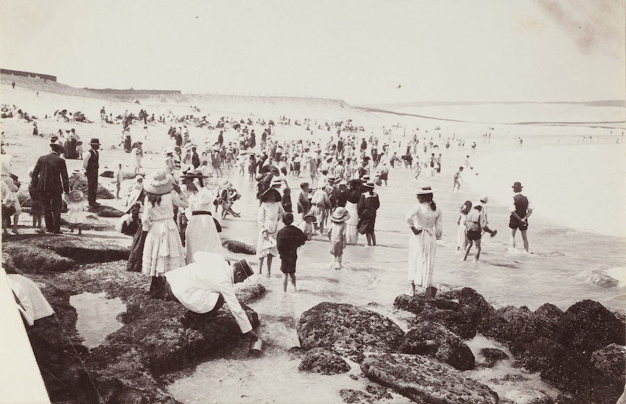 Image 1 of 3 - A black and white photo of a crowd of people in Edwardian clothes on the beach