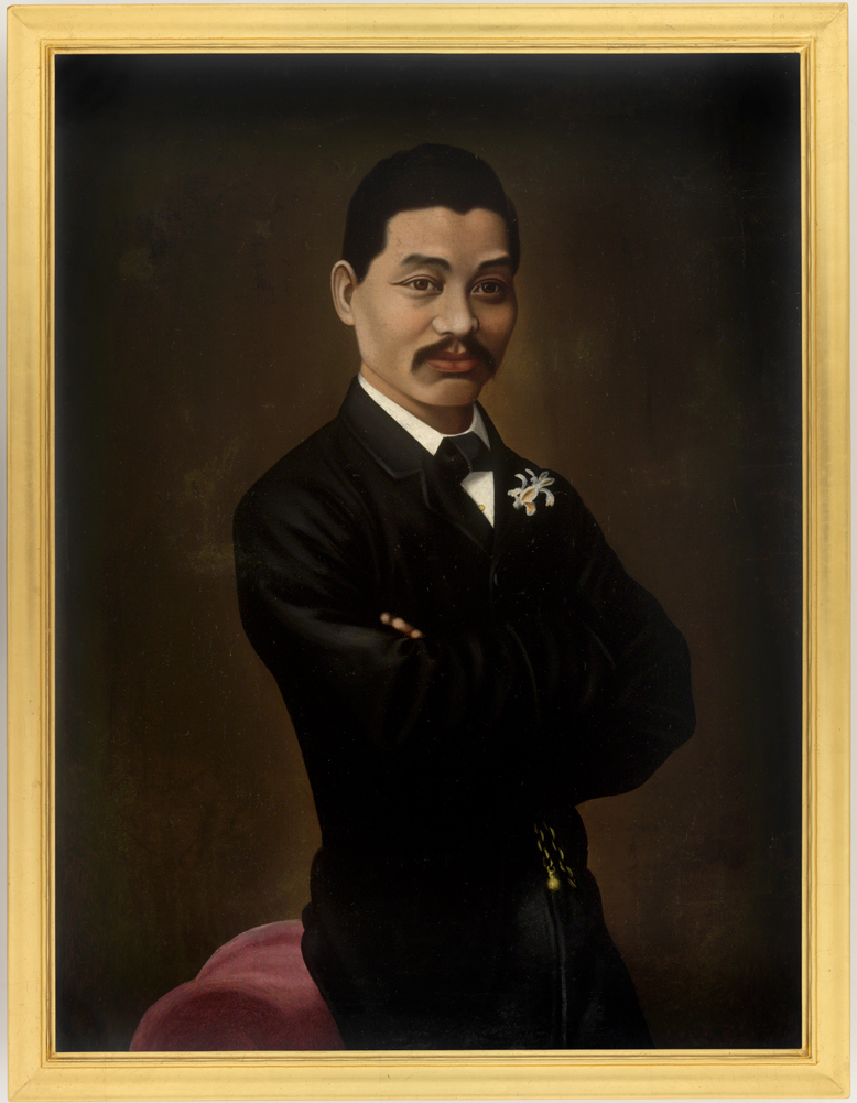 Image 5 of 6 - Portrait of Mei Quong Tart in a tuxedo and bow tie, leaning on a pink chair.