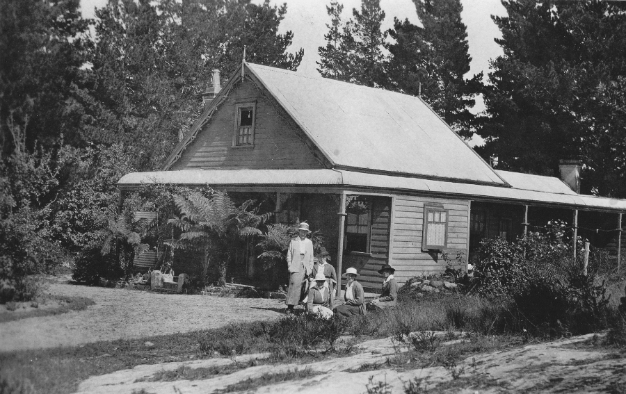 Image 4 of 4 - Black and white photograph of five women outside a cottage