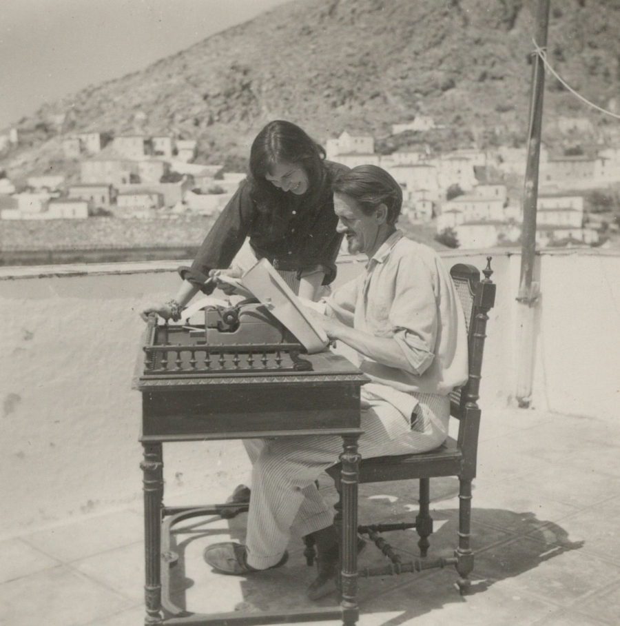 Image 1 of 5 - A black and white photograph of a man and a woman in front of a typewriter