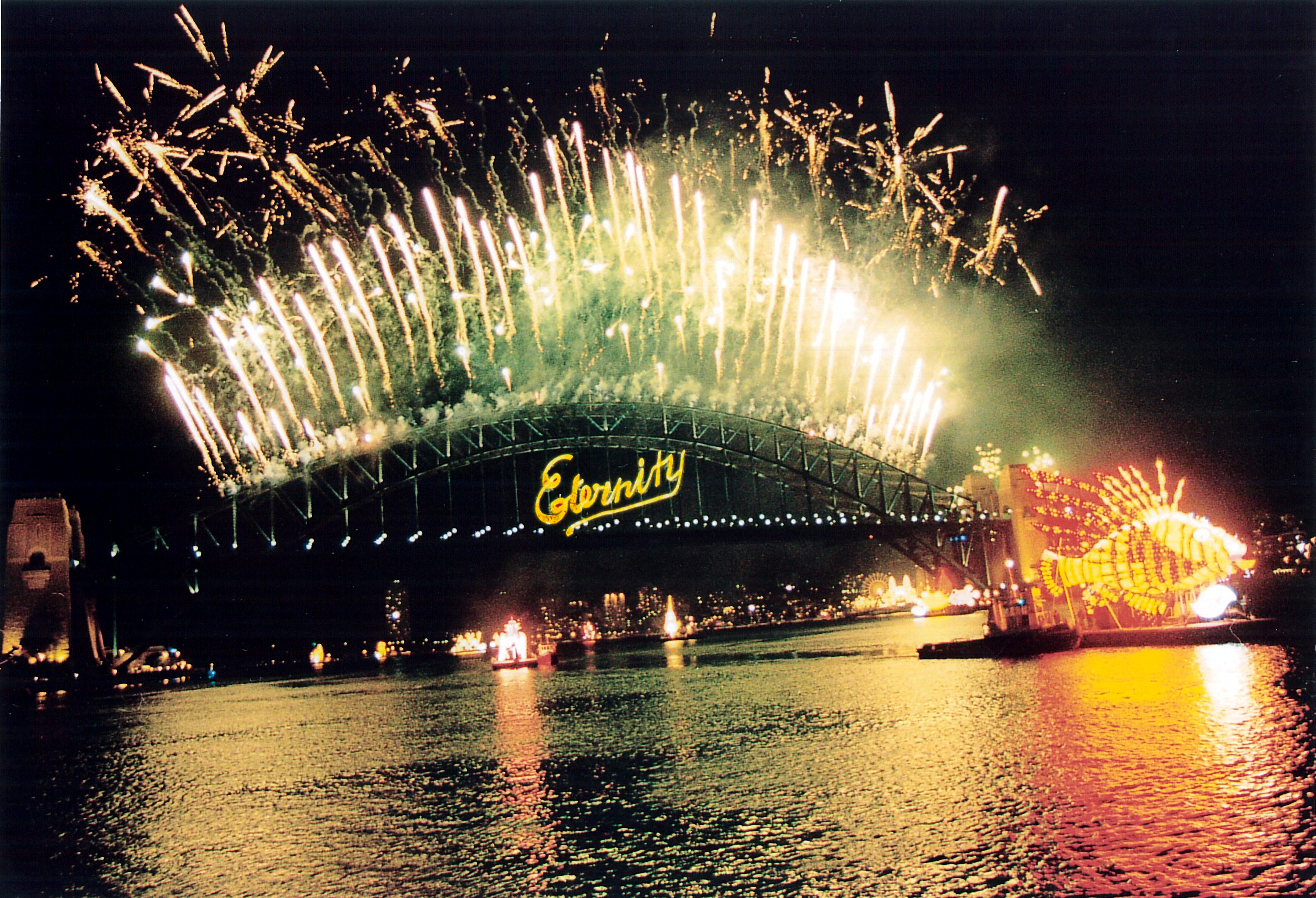 Image 4 of 4 - Fireworks on the Sydney Harbour Bridge with the word ‘Eternity’ on the face of the bridge.